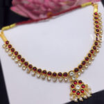 Gold Finish Kemp Necklace - Red and White Stones